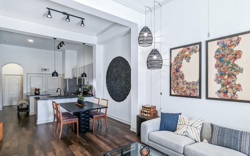 a living room with a table and chairs