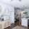 a kitchen with white cabinets