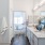 a bathroom with a tub sink and a mirror