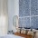 a bedroom with a bed and a fan